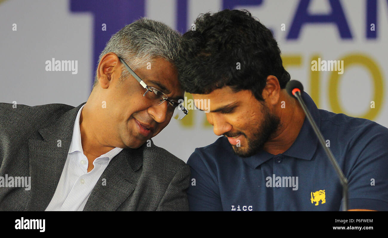 Sri Lankan Sports minister Faiszer Musthapha (L) speaks with Sri Lanka’s cricket captain Dinesh Chandimal (R) during a press conference. (Photo by Pradeep Dambarage / Pacific Press) Stock Photo