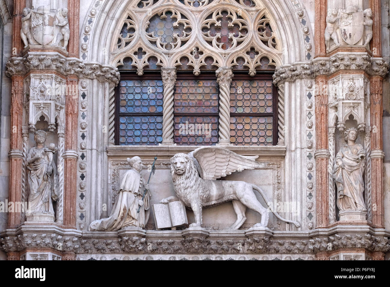 Detail of the Porta della Carta entrance to the Doge's Palace in Venice, Italy, depicting Doge Francesco Foscari kneeling before the Lion of St. Mark Stock Photo