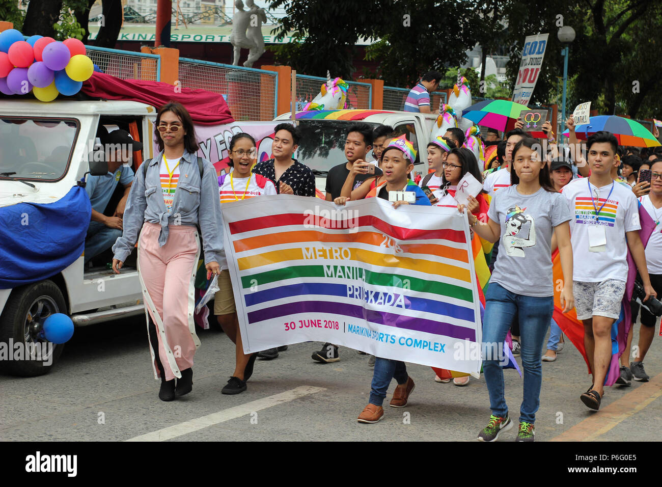 Members marching with a banner during the event. Thousands gathered