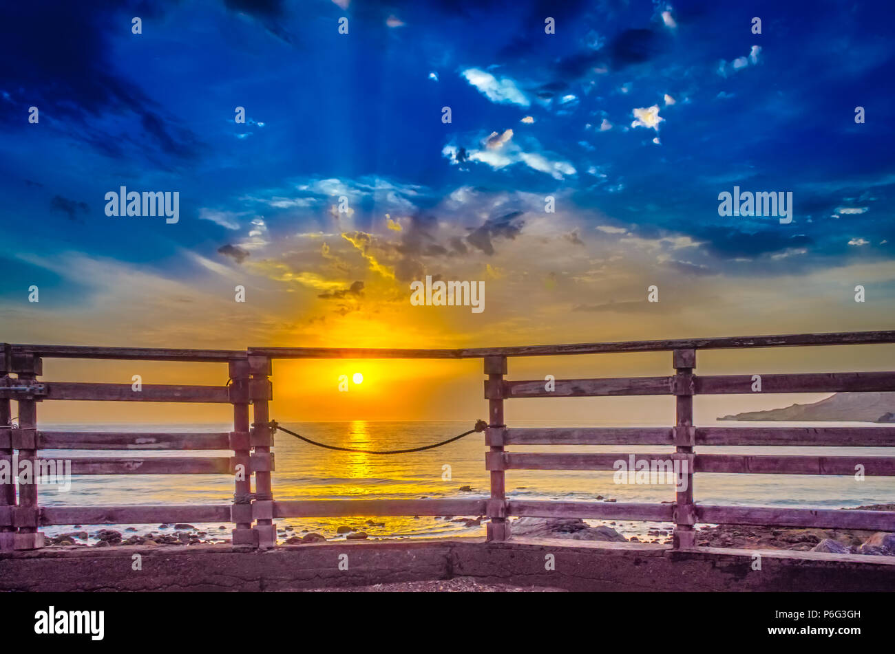 Welcoming a new day from the lawn of an old beach house. Stock Photo