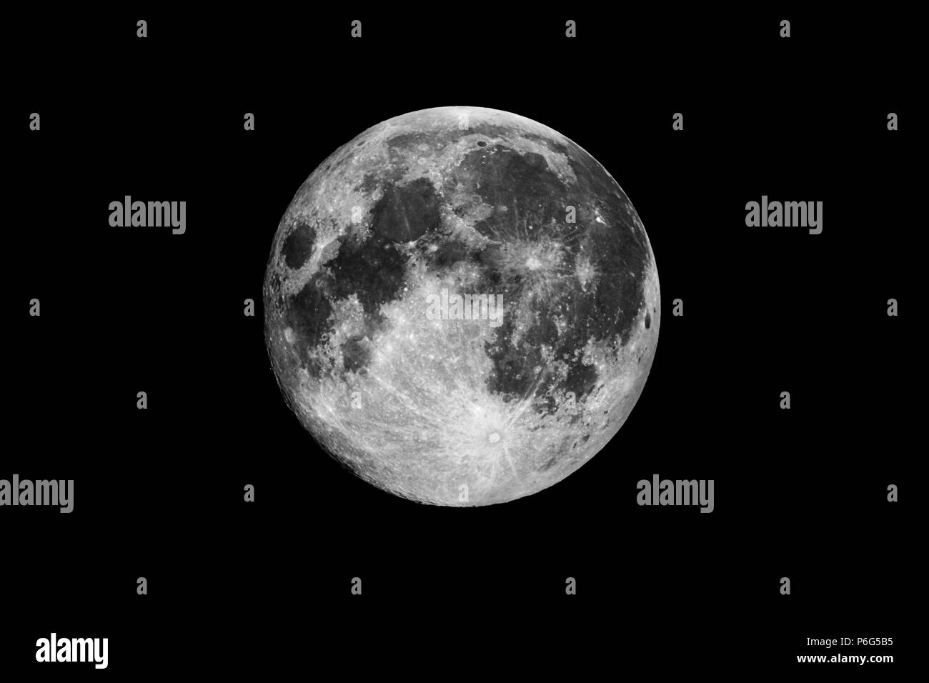 Full Moon / The Moon is an astronomical body that orbits planet Earth and is Earth's only permanent natural satellite. It is the fifth-largest natural Stock Photo