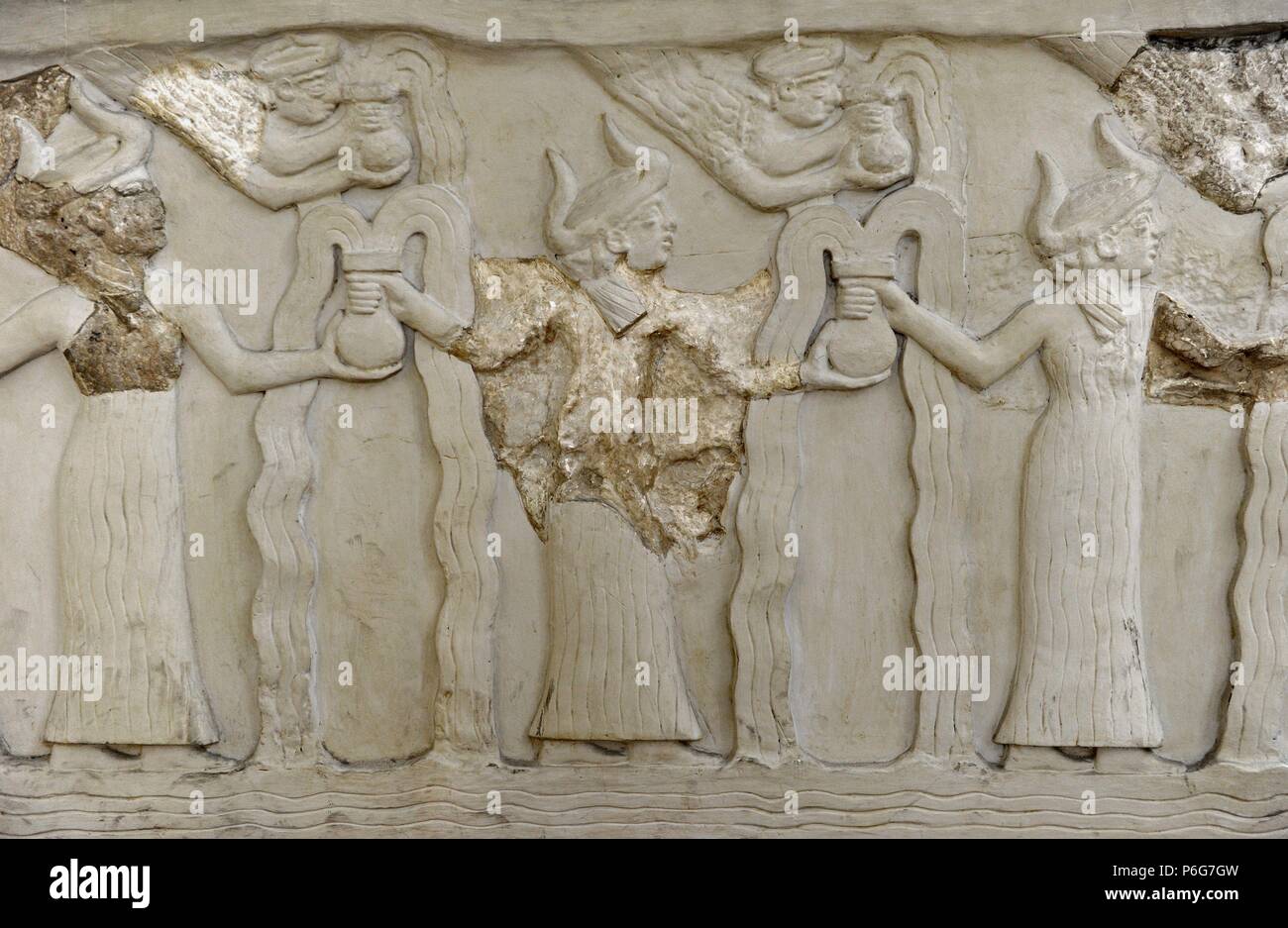 Sacred Basin. Gift of Gudea, governor of Lagash, to the temple of the God Ningirsu. Gudea Period. 2144-2124 BC. Relief depicting winged goddess reaching and holding a round based vessel. Museum of the Ancient Orient. Istanbul. Turkey. Stock Photo