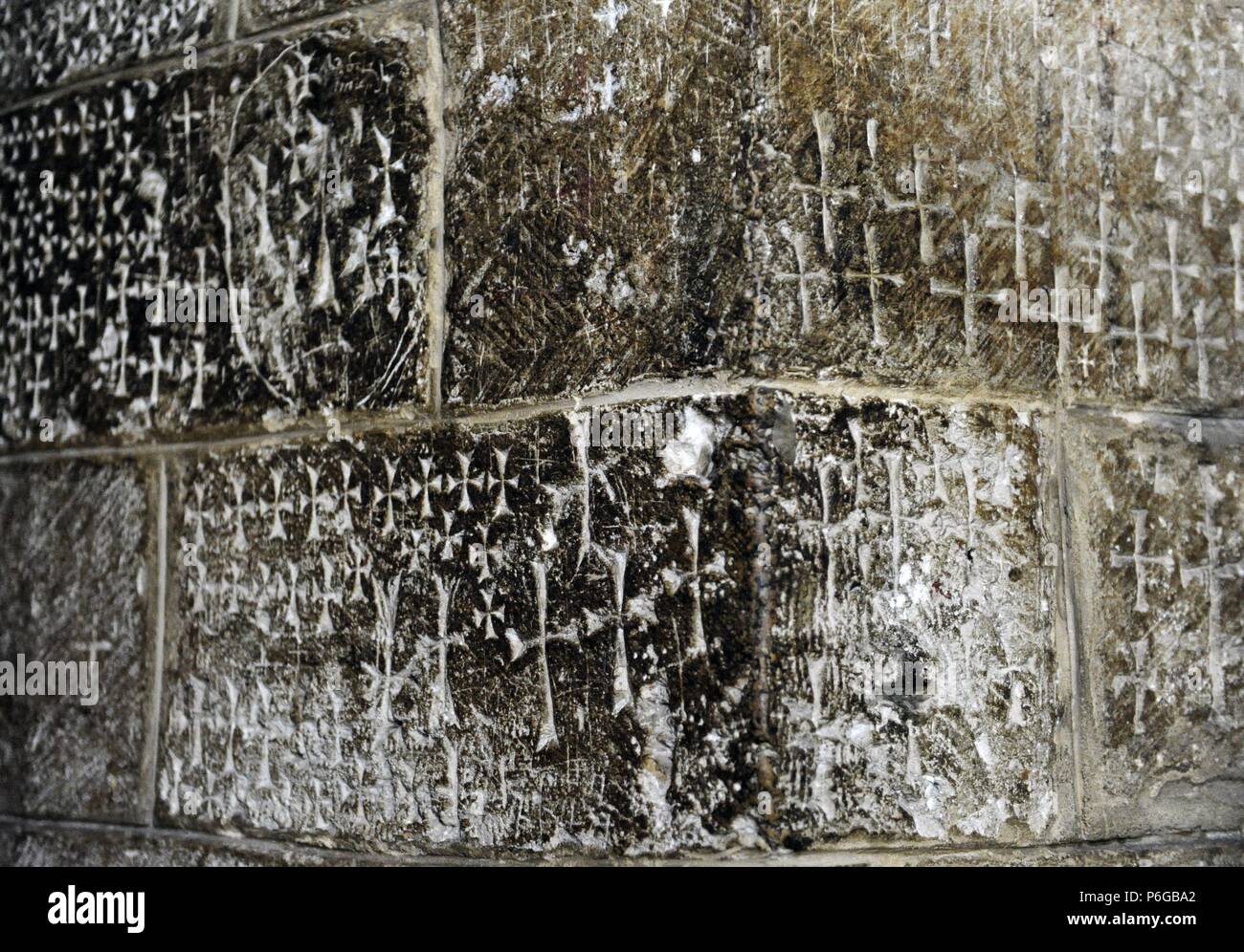 Crusader graffiti on the walls of the stairs leading to the Chapel of Saint Helena, in the Church of the Holy Sepulchre, in the Old city of Jerusalem. Israel. Stock Photo