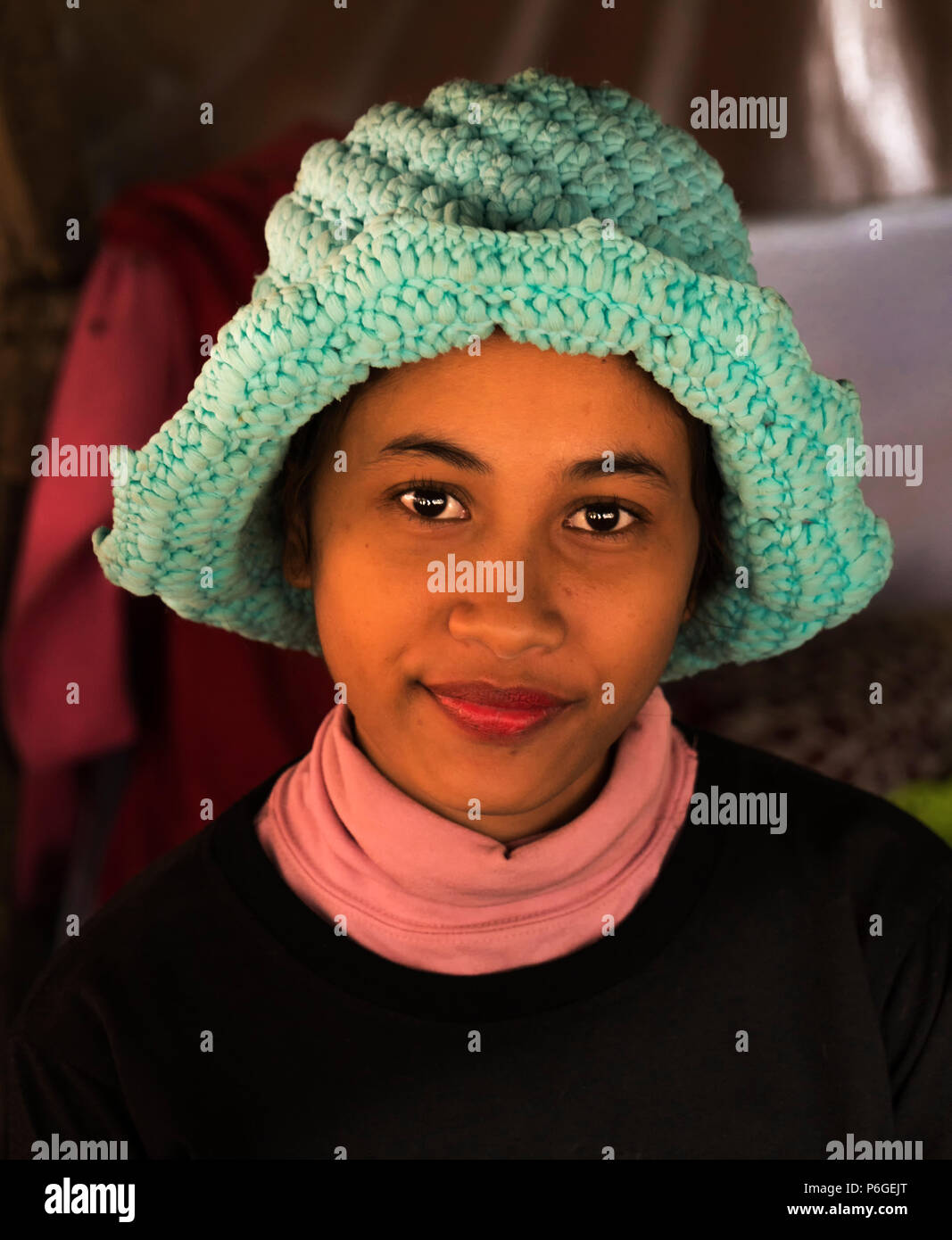 A beautiful Cambodian girl in a local woollen hat Stock Photo