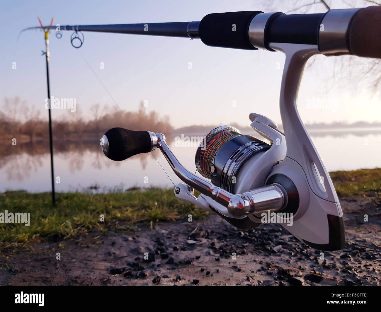 Fisherman's reel, mounted on a fishing rod. Feeder fishing in English style  Stock Photo - Alamy