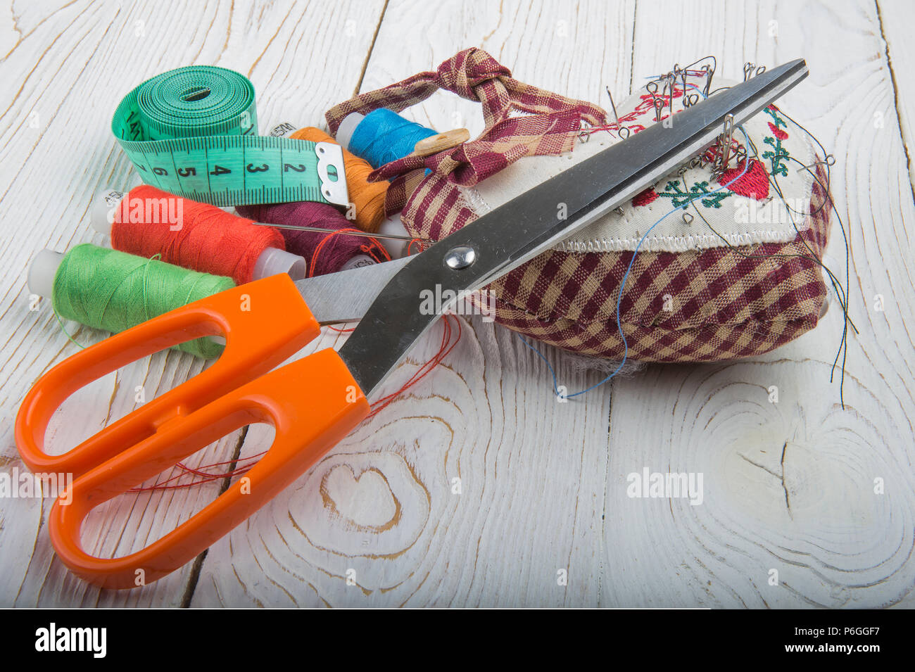 Tools for sewing- thread, scissors, pins Stock Photo