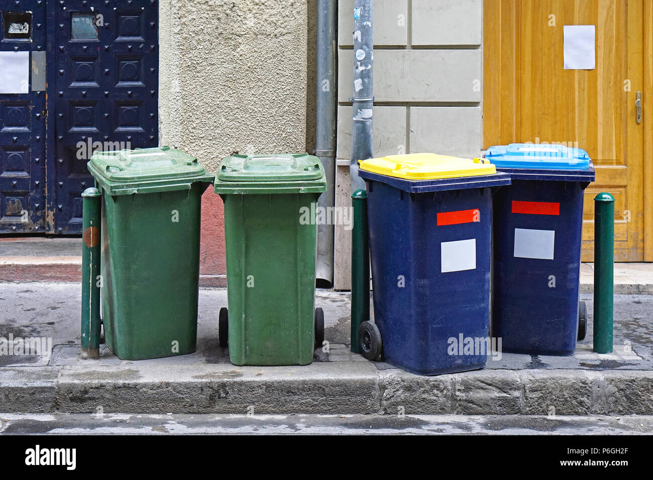 Garbage bins at street waiting for collection Stock Photo - Alamy