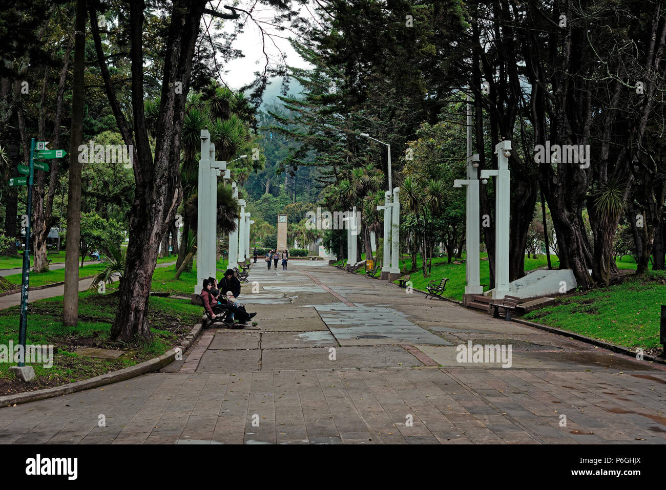 People sitting 0n a path in the Parque Nacional, Bogota, amongst the natural environment. Colombia Stock Photo