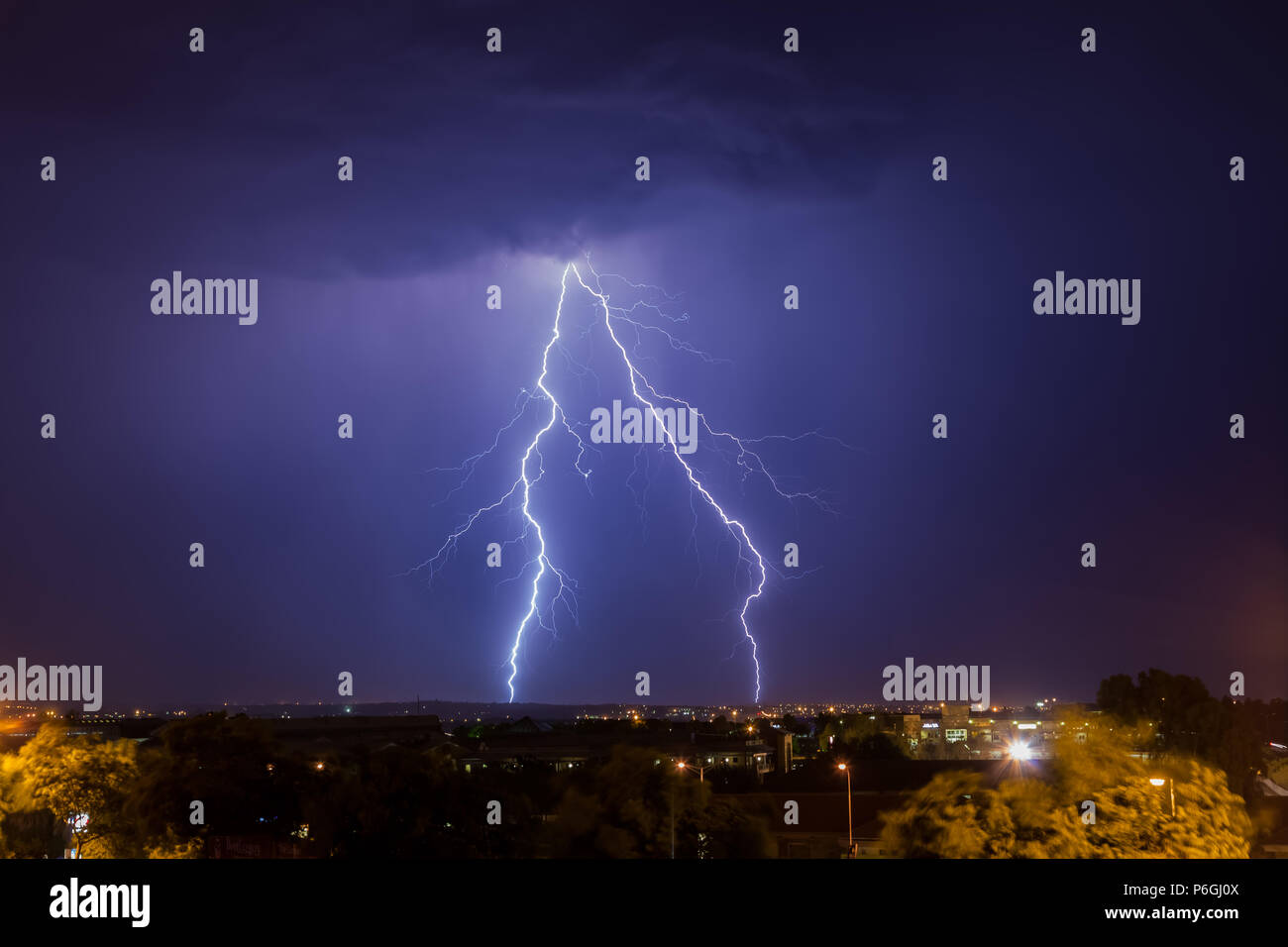 Cloud to ground lightning strike over Johannesburg at night time. This
