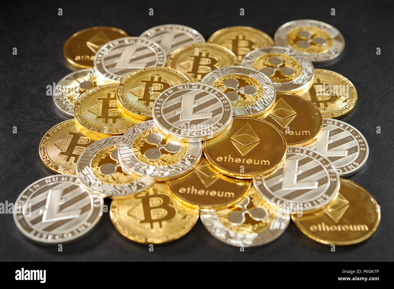 Big pyramid from real cryptocurrency coins. Bitcoins, litecoins, etherum,  ripple Stock Photo - Alamy