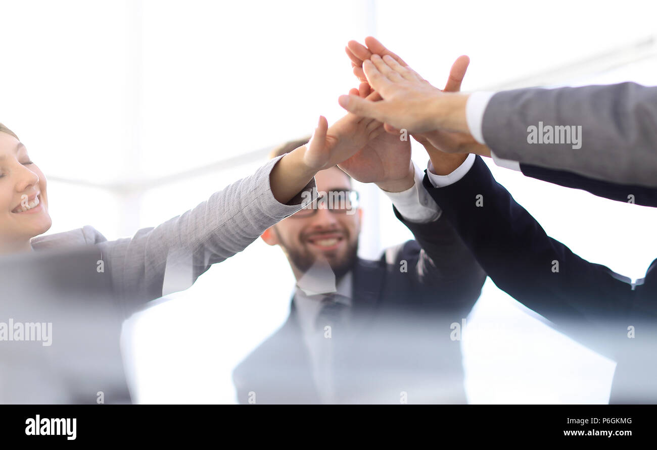 happy business team giving high five in office Stock Photo - Alamy
