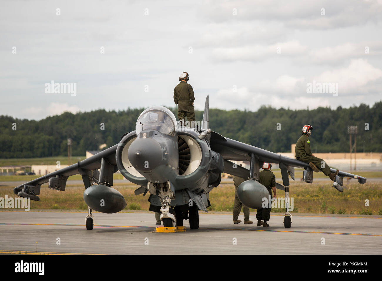 Marine Attack Squadron (VMA) 214 Marines participate in the 2018 Arctic Thunder Air Show at Joint Base Elmendorf-Richardson, Alaska, June 29, 2018. VMA-214 conducted a flyby and hover demonstration with the AV-8B Harrier during the air show. (U.S. Marine Corps photo by Lance Cpl. Sabrina Candiaflores) Stock Photo