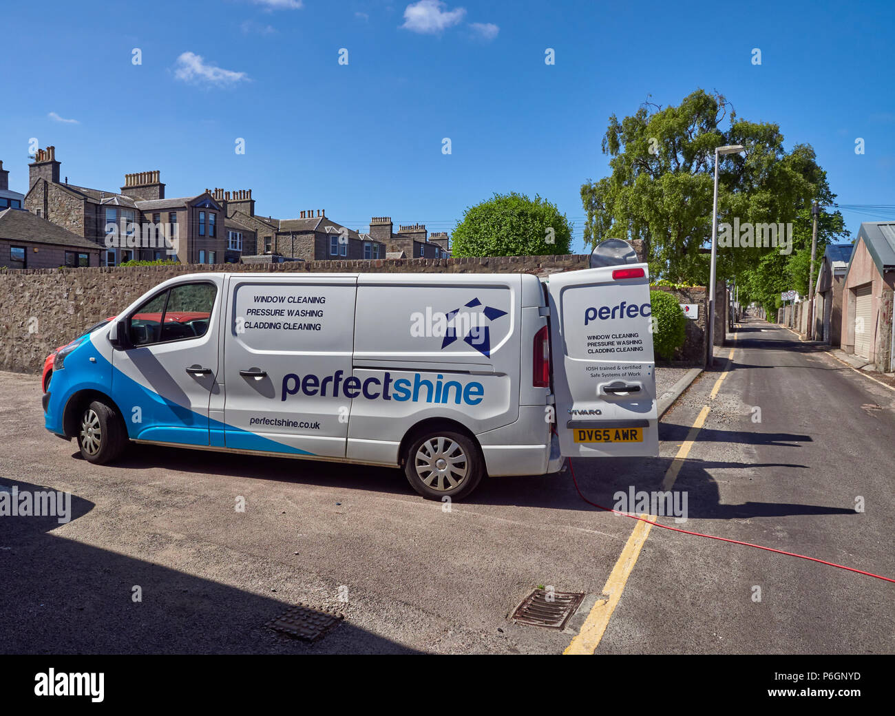 Perfectshine, a small Window Cleaning Company in Aberdeen with one of its  Vans parked in Albert Lane, while its Operator does work across the Road.  Ab Stock Photo - Alamy