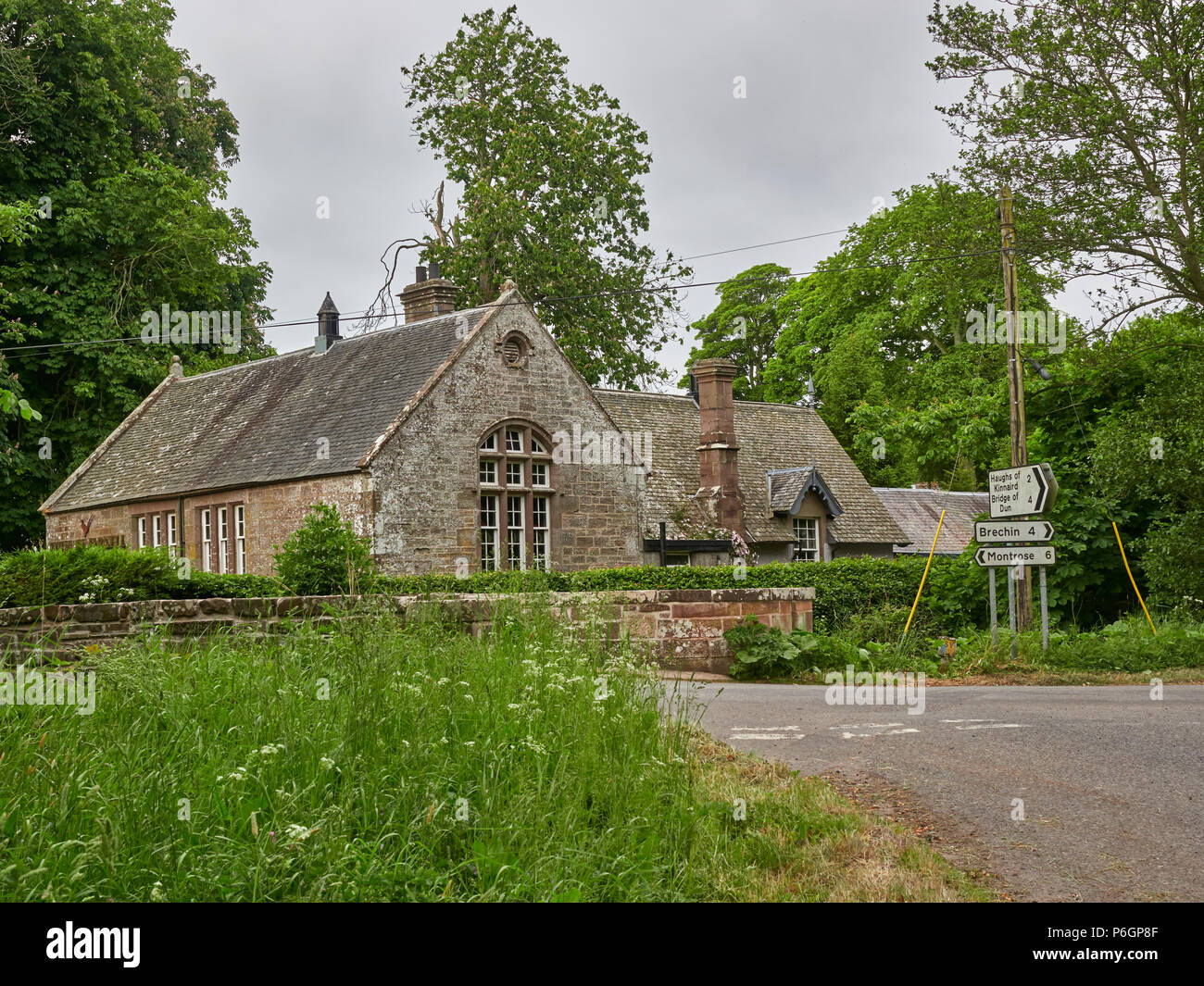 The Old School, now a commercial Property selling home and Christmas decorations at Farnell Village  Crossroads in Angus, Scotland. Stock Photo