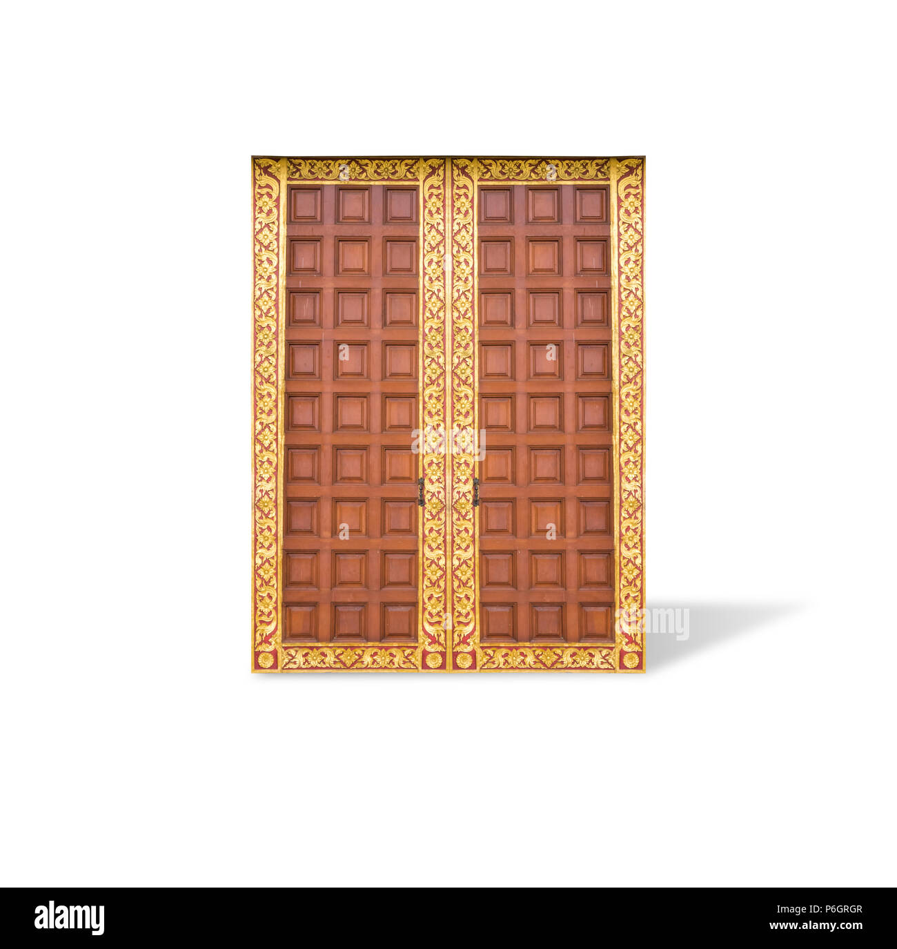 Wooden door with Thai ornamental motif, isolated on white background with clipping path. Stock Photo