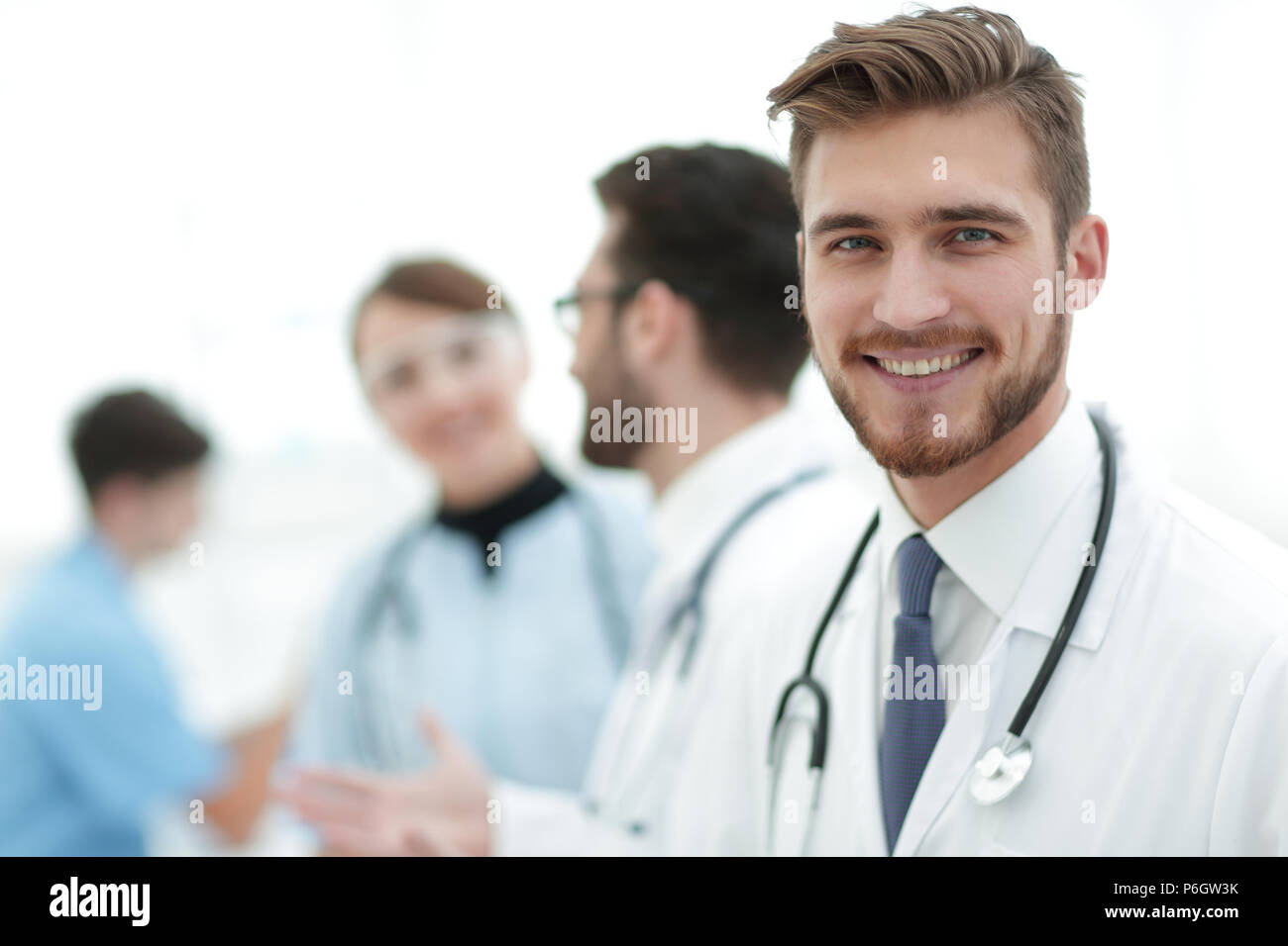 Portrait of friendly male doctor smiling Stock Photo - Alamy