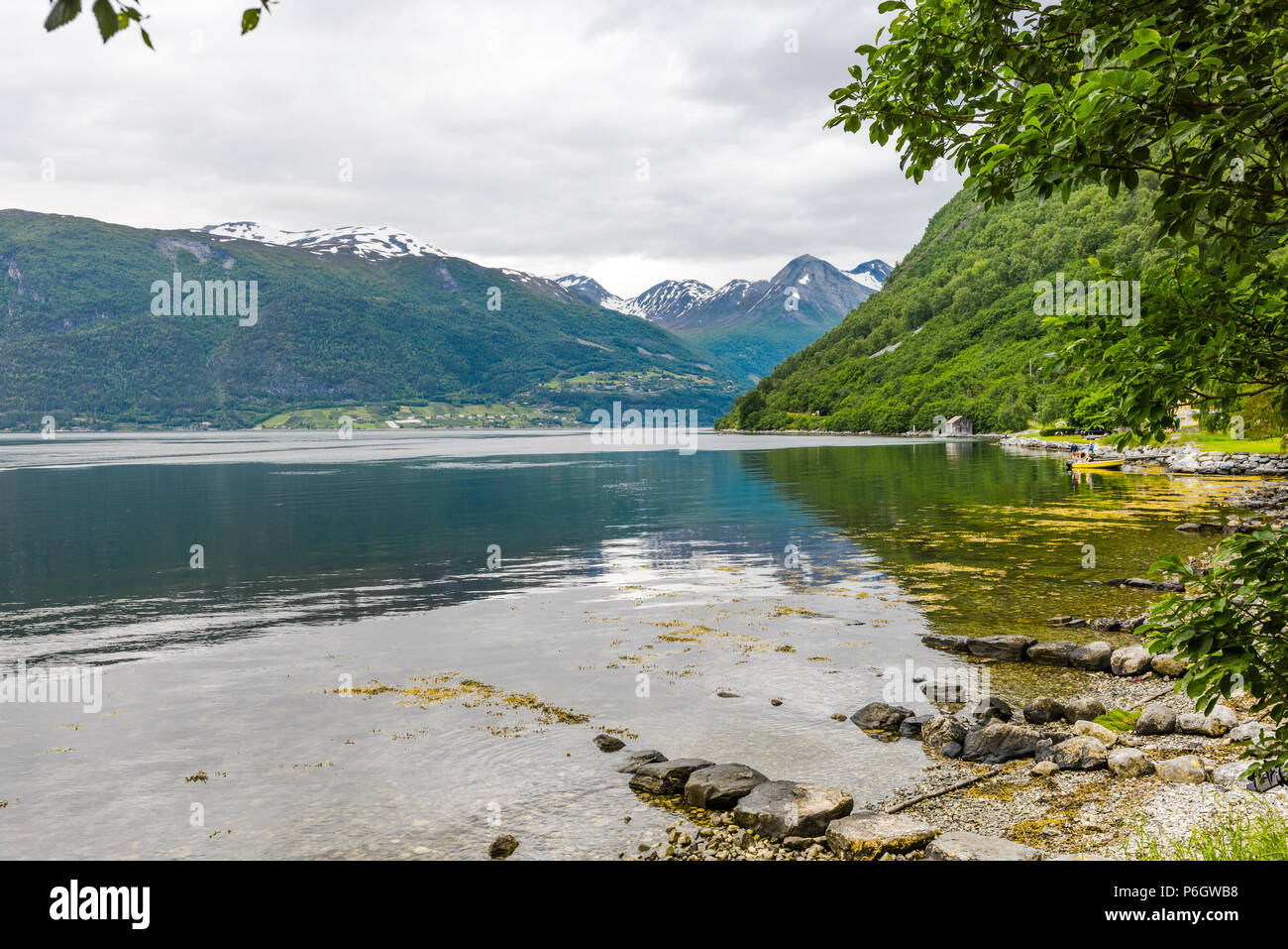 fjord view at the shore of Norddal, Norway, the Norddalsfjorden near Eidsdal and eagle road Stock Photo