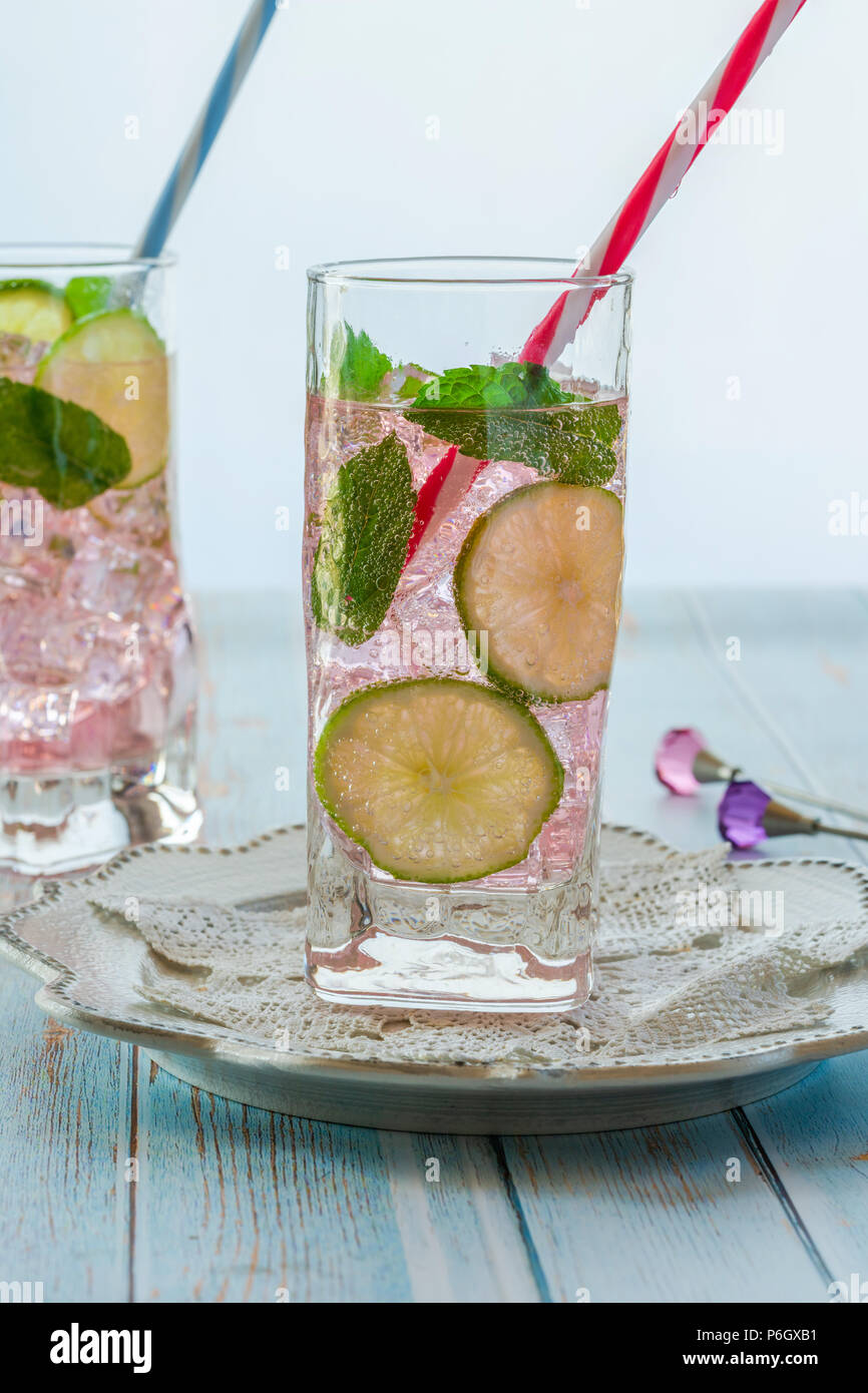 Pink rose lemonade with lime and fresh mint. Refreshing summer non