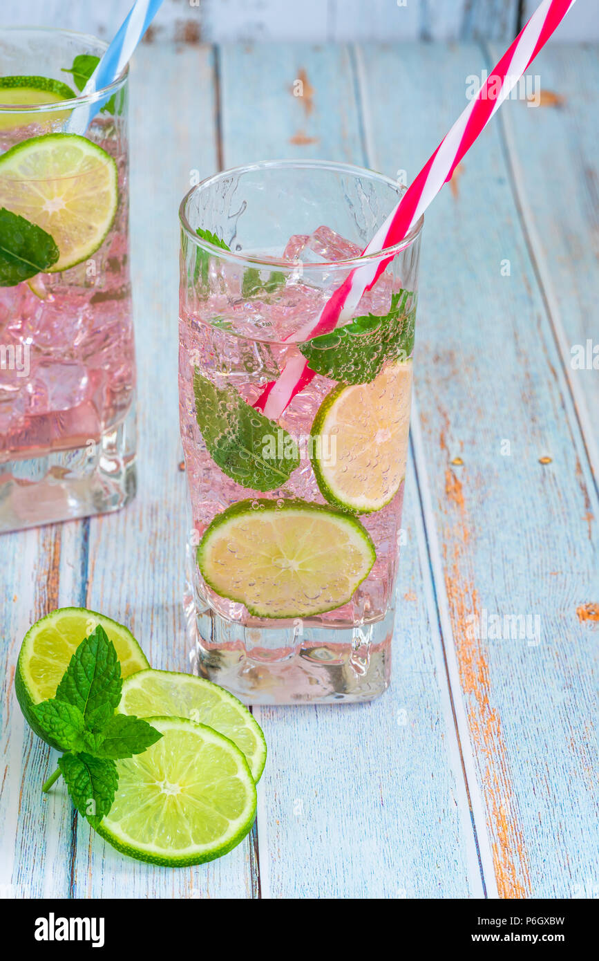 Pink rose lemonade with lime and fresh mint. Refreshing summer non
