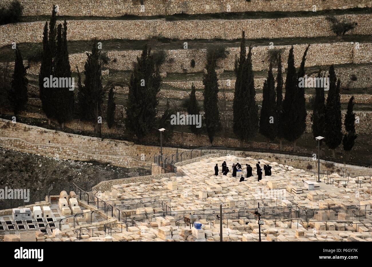 Judaism. Orthodox Jews performing a ritual. Mount of Olives Jewish Cemetery. Jerusalem. Israel. Stock Photo