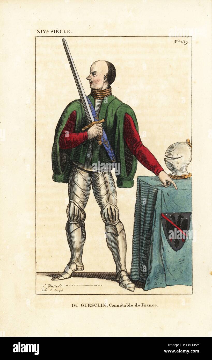 Bertrand du Guesclin, Constable of France, 1314-1380. He wears a velvet pelisse over plate armour, holds the constable's sword. On a table is a helm and Guesclin blazon: argent, sable eagle, band gules. From an ancient drawing. Handcoloured copperplate drawn and engraved by Leopold Massard from 'French Costumes from King Clovis to Our Days,' Massard, Mifliez, Paris, 1834. Stock Photo