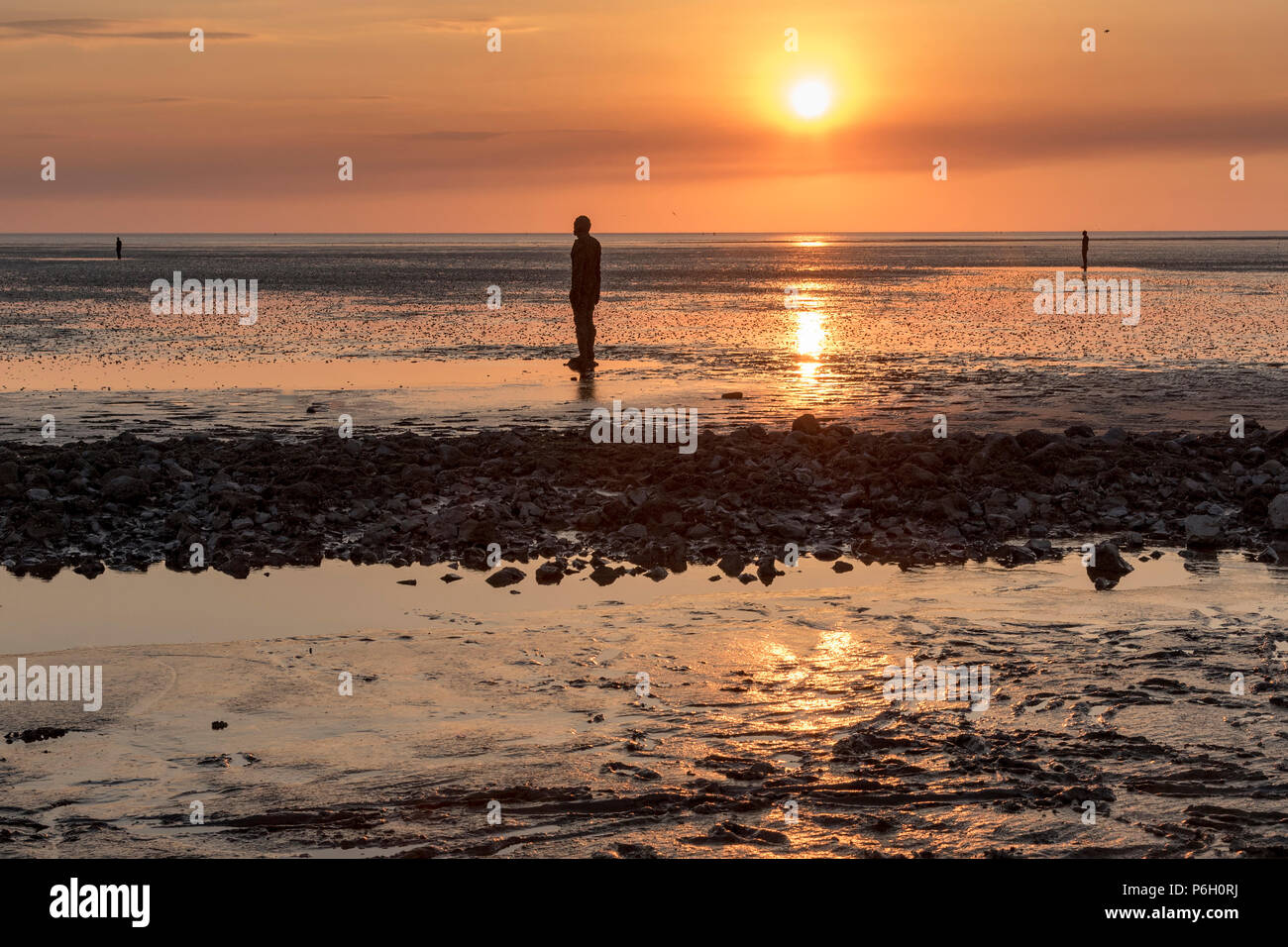 Sunset. Crosby beach. Liverpool North West England. Antony Gormley