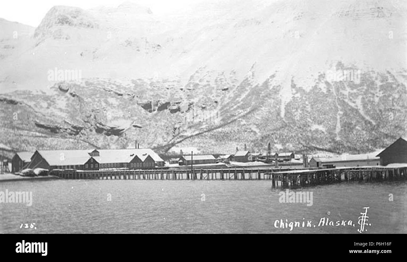 . English: Salmon cannery, Chignik, ca. 1912 . English: Caption on image: Chignik, Alaska PH Coll 247.35 The City of Chignik is located on Anchorage Bay on south shore of the Alaska Peninsula, 450 miles southwest of Anchorage and 260 miles southwest of Kodiak. Prior to Chignik, a Kaniagmuit Native village called Kaluak was located here; it was destroyed during the Russian fur boom in the late 1700s. Chignik, a Sugpiaq word meaning 'big wind' was established in the late 1800s as a fishing village and cannery. A four-masted sailing ship called the 'Star of Alaska' transported workers and supplie Stock Photo