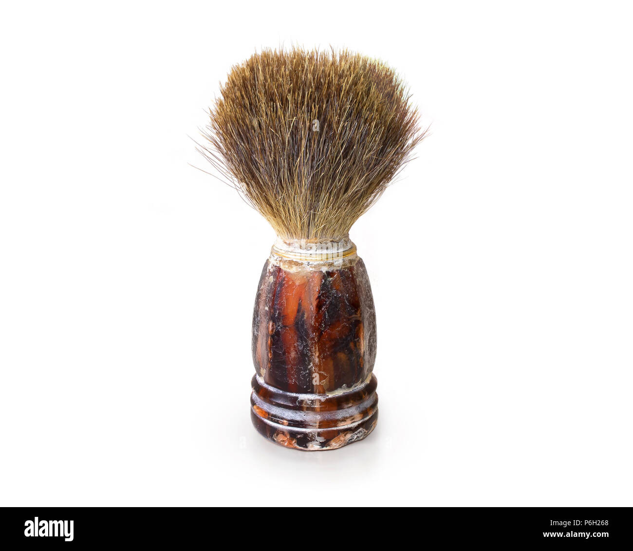 Old shaving brush isolated. Retro mens swab stand on white background. Antique barber tool. Classic shave brush accessories. Curiosity haircutter swob. Stock Photo