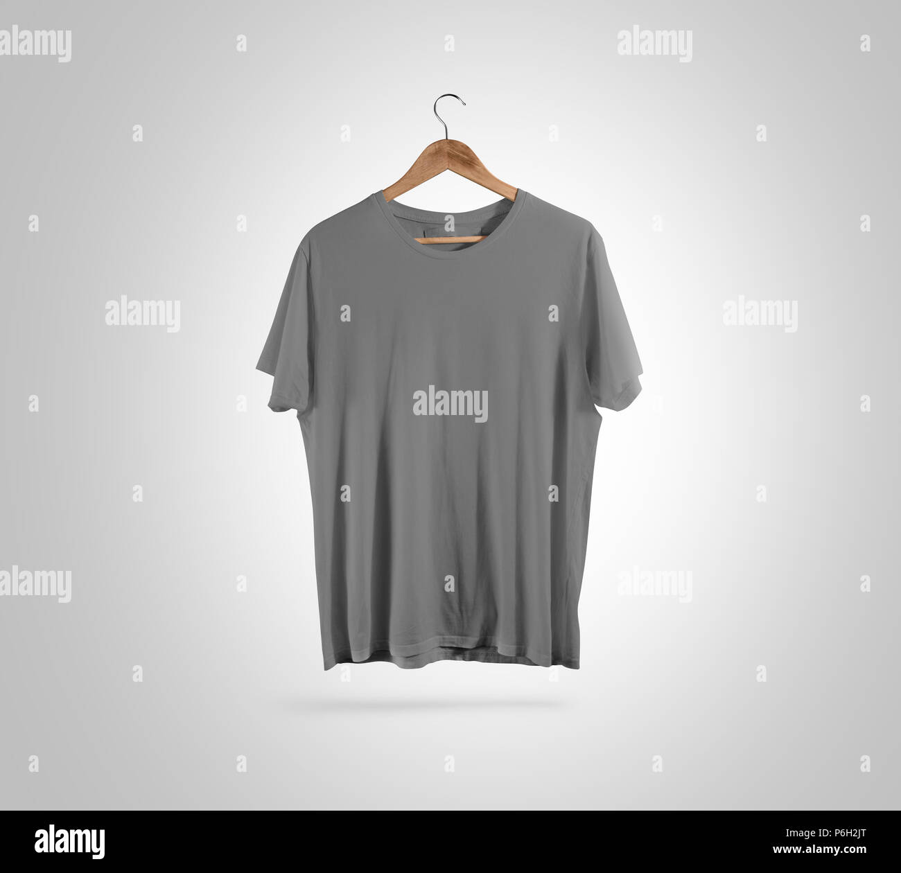 Blank grey t-shirt front side view on hanger, design mockup, clipping path. Gray clear plain cotton tshirt mock up template. Apparel store logo branding display. Crew shirt surface hang on wood hanger Stock Photo