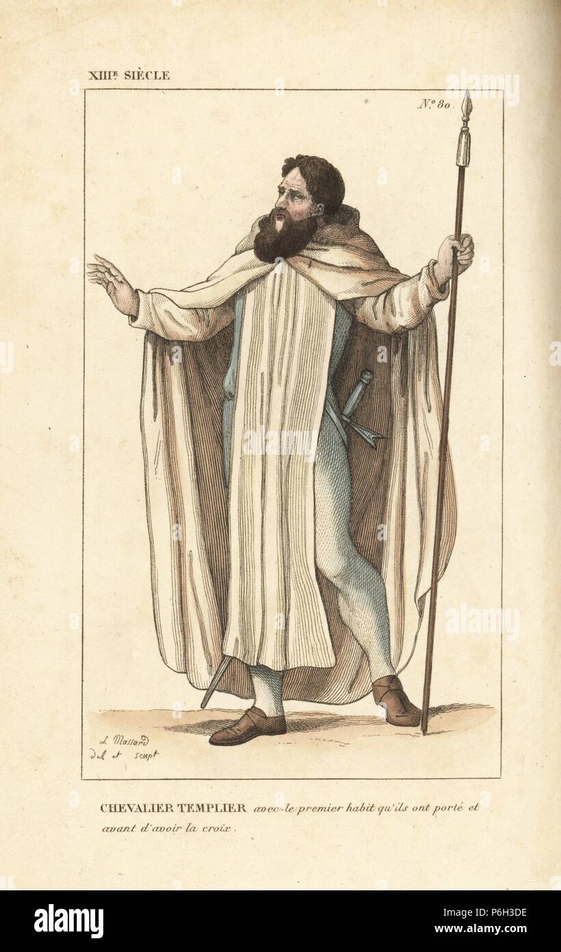 Knight Templar, elite rank, 13th century. He wears a white hooded cape, tunic and leather shoes. He carries a lance and sword. Originally the order did not wear the red cross. Handcoloured copperplate drawn and engraved by Leopold Massard from 'French Costumes from King Clovis to Our Days,' Massard, Mifliez, Paris, 1834. Stock Photo