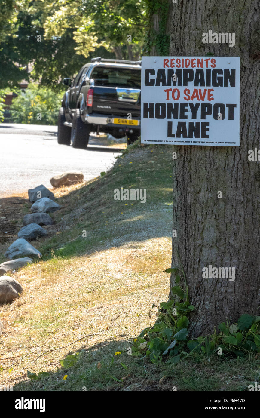 Protest placards against greenbelt development by local residents over the proposed building of 250 homes on a greenbelt site in Brentwood, Essex Stock Photo