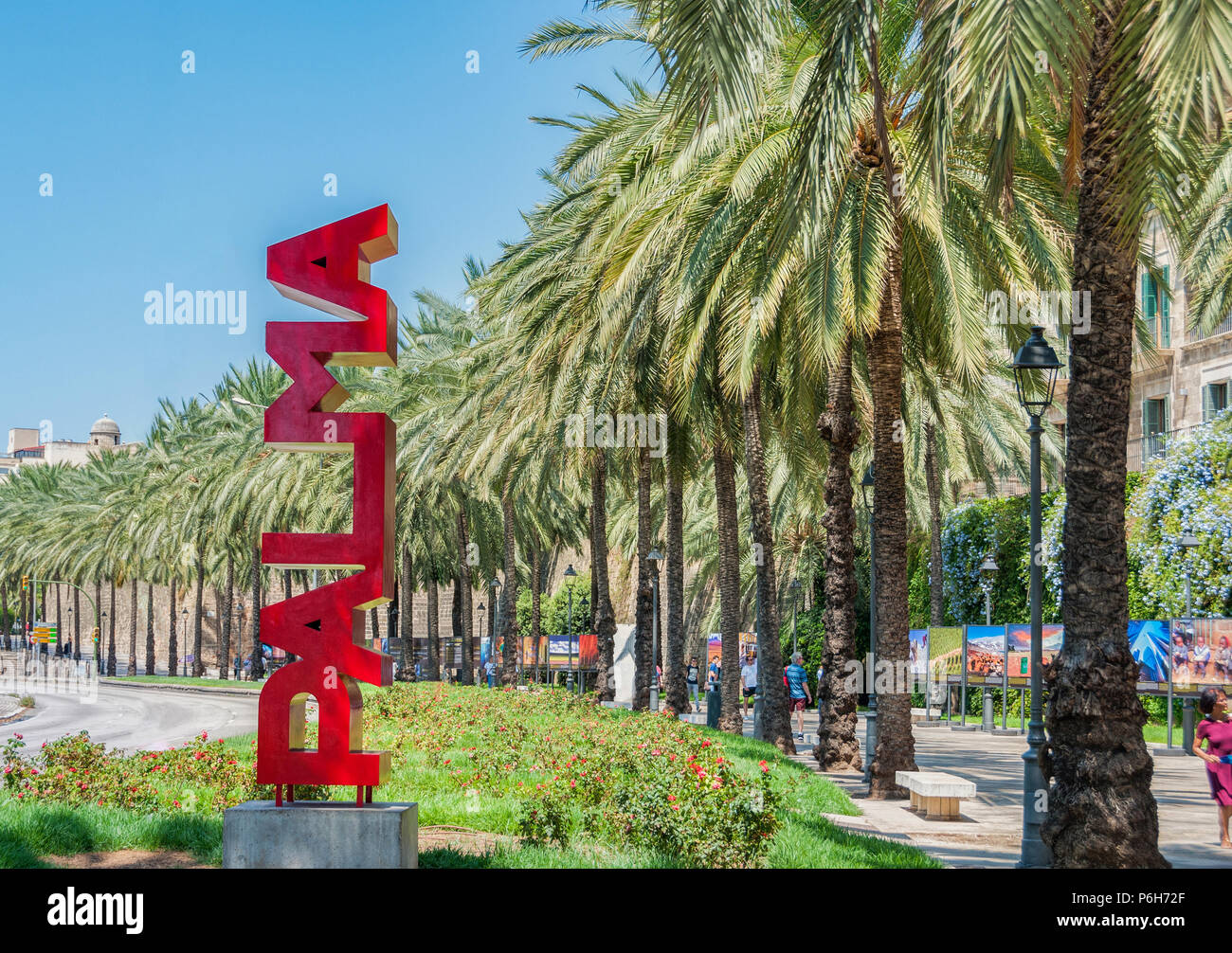 30 July 2017 - Palma de Majorca, Spain. Beautiful capital and the largest city of the Balearic islands. Red Palma sign and Palma trees in the background Stock Photo