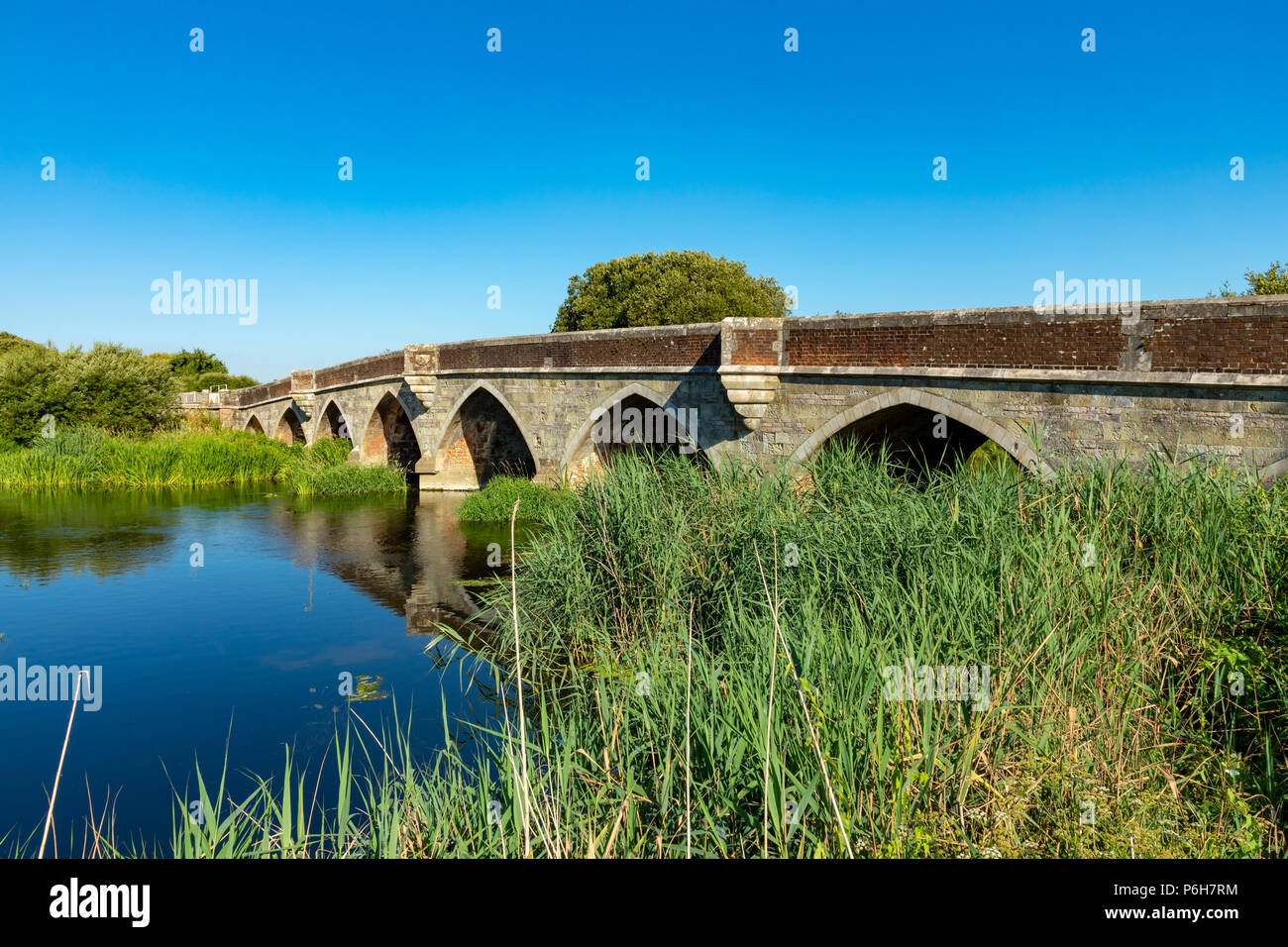 Wimborne Minster Dorset England June 30, 2018 Old stone bridge crossing