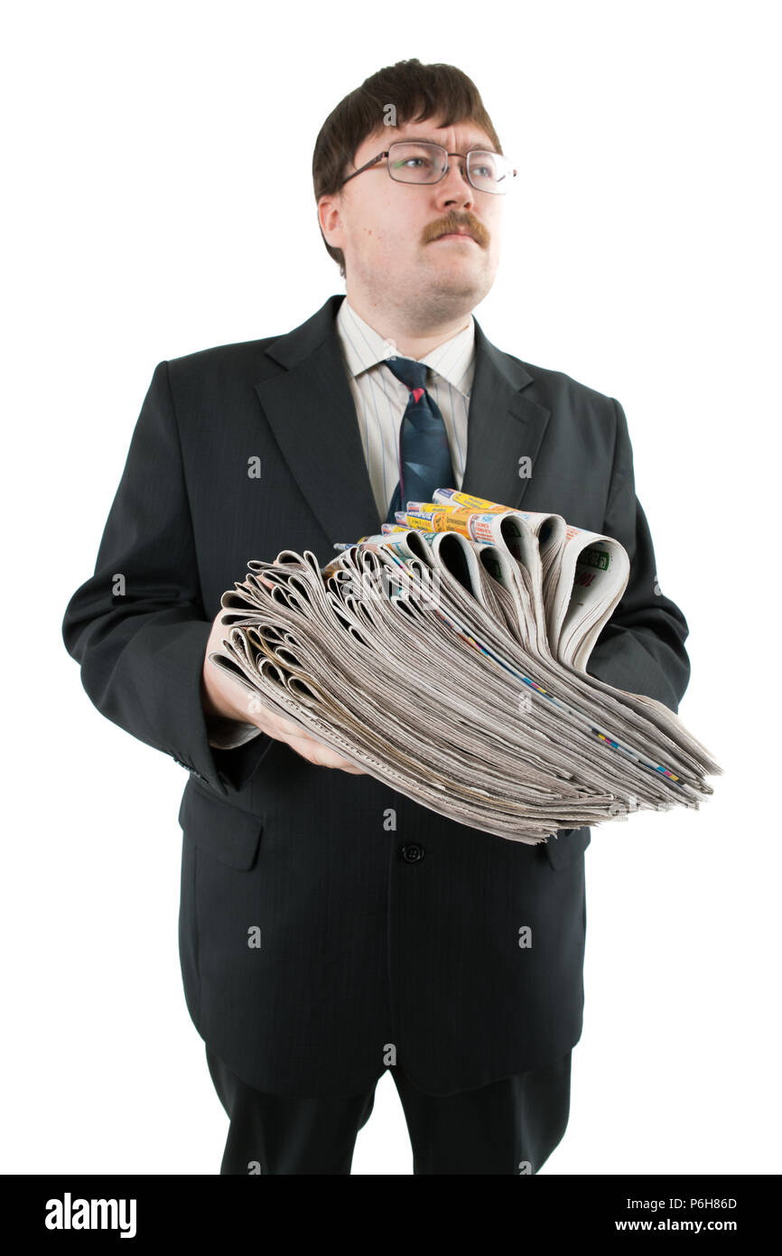 man holding a stack of newspapers isolated on a white background Stock Photo