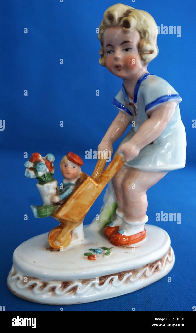 Vintage Art Deco German Porcelain Figure or Figurine Child Playing With