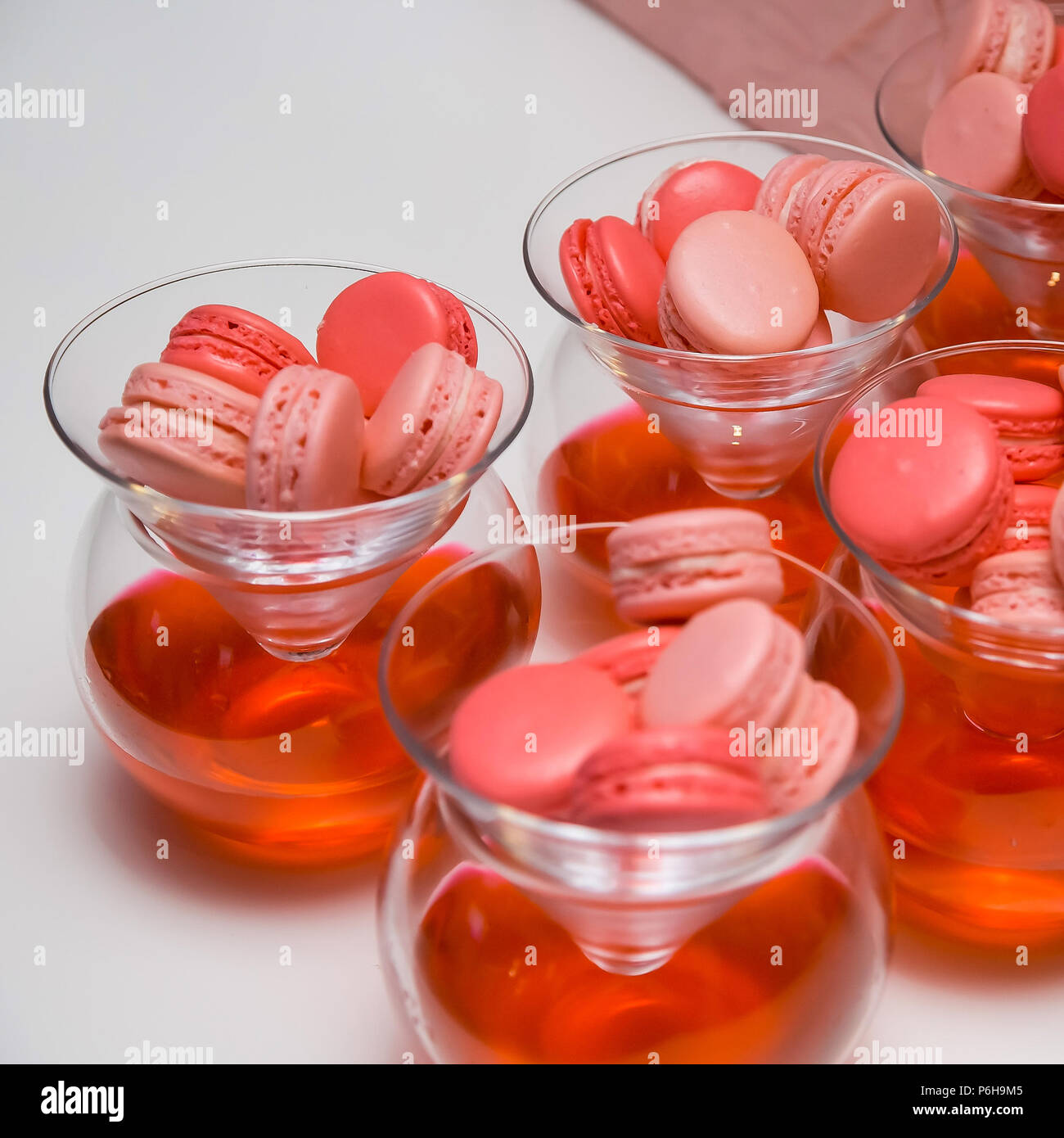 Display of sweet pink dessert cake macaroons for catering at gala dinner banquet event Stock Photo