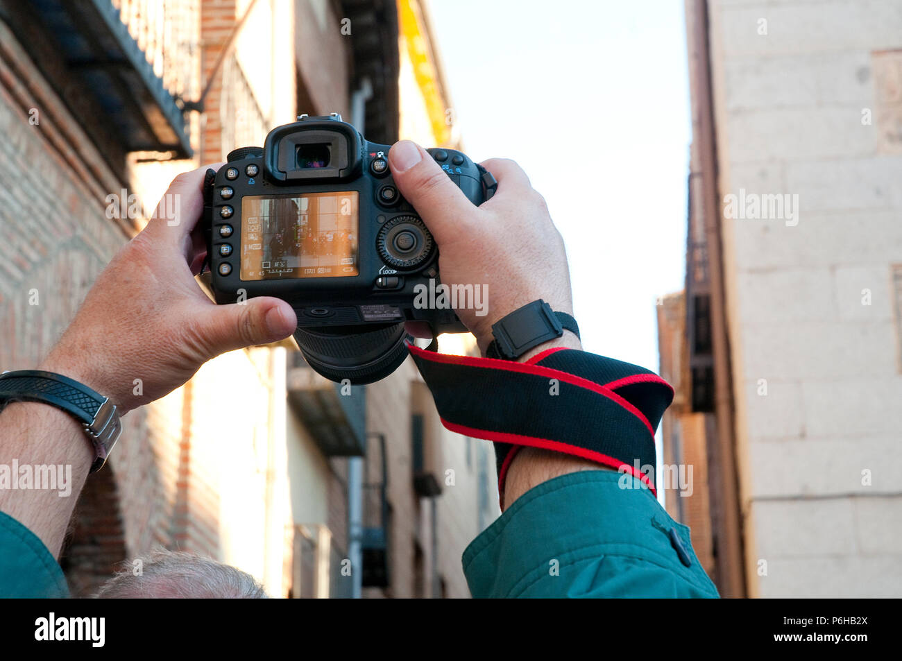 Man photographing a Holy Week procession. Madrid, Spain. Stock Photo