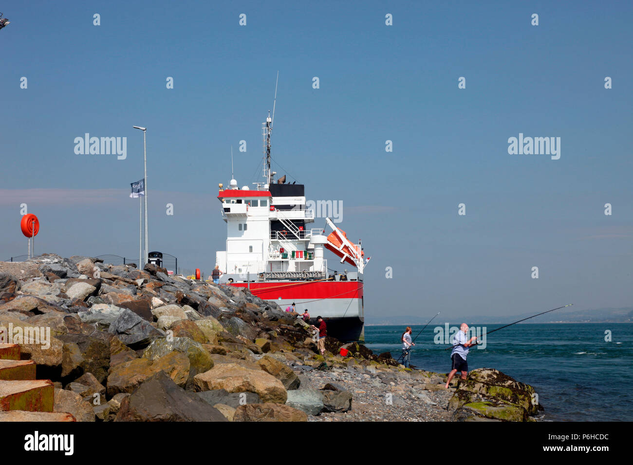 Angler fishing in Carlingford Lough at Greenore, Co. Louth Stock Photo