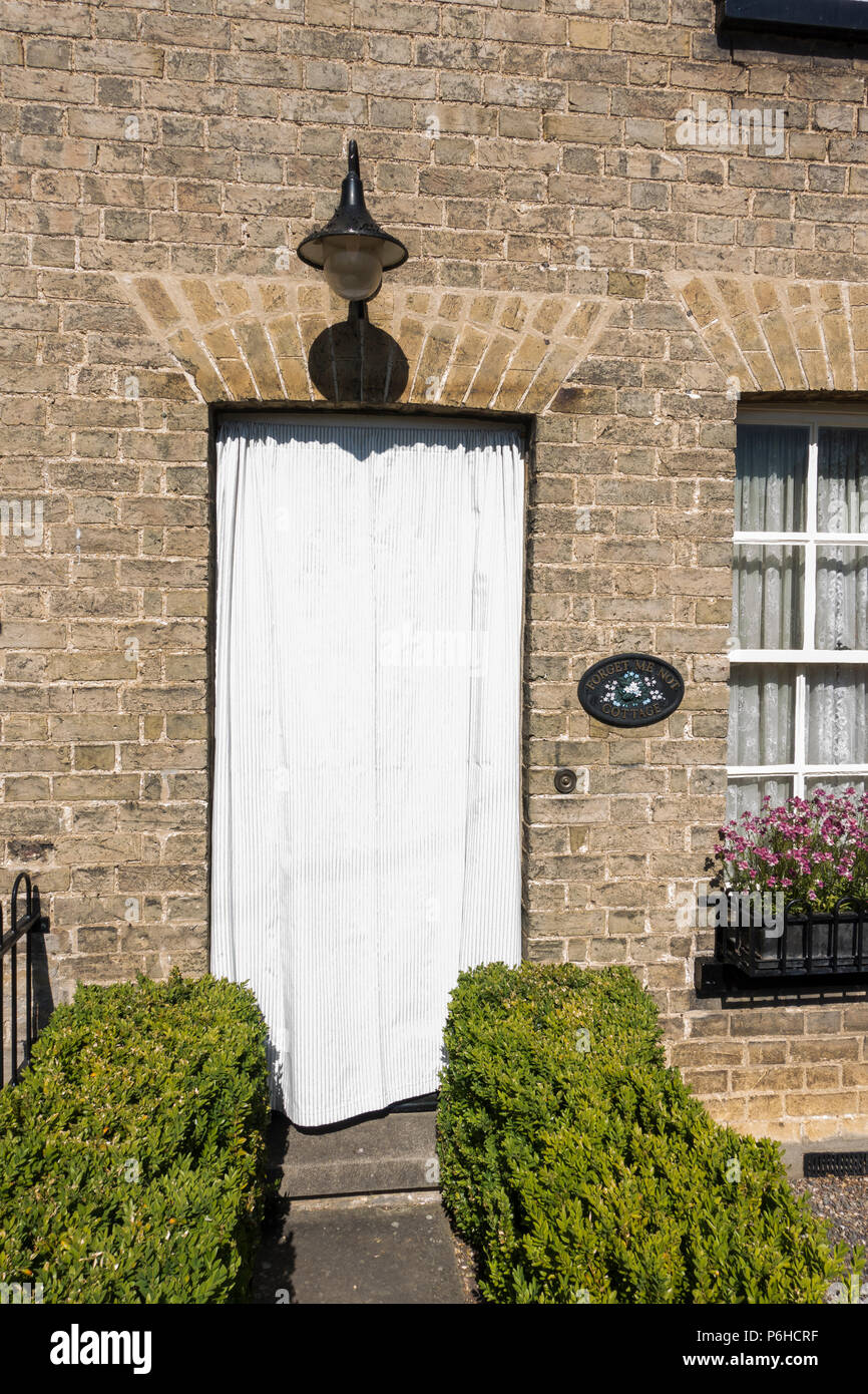 White door cover to prevent paint blistering in hot sun Stock Photo