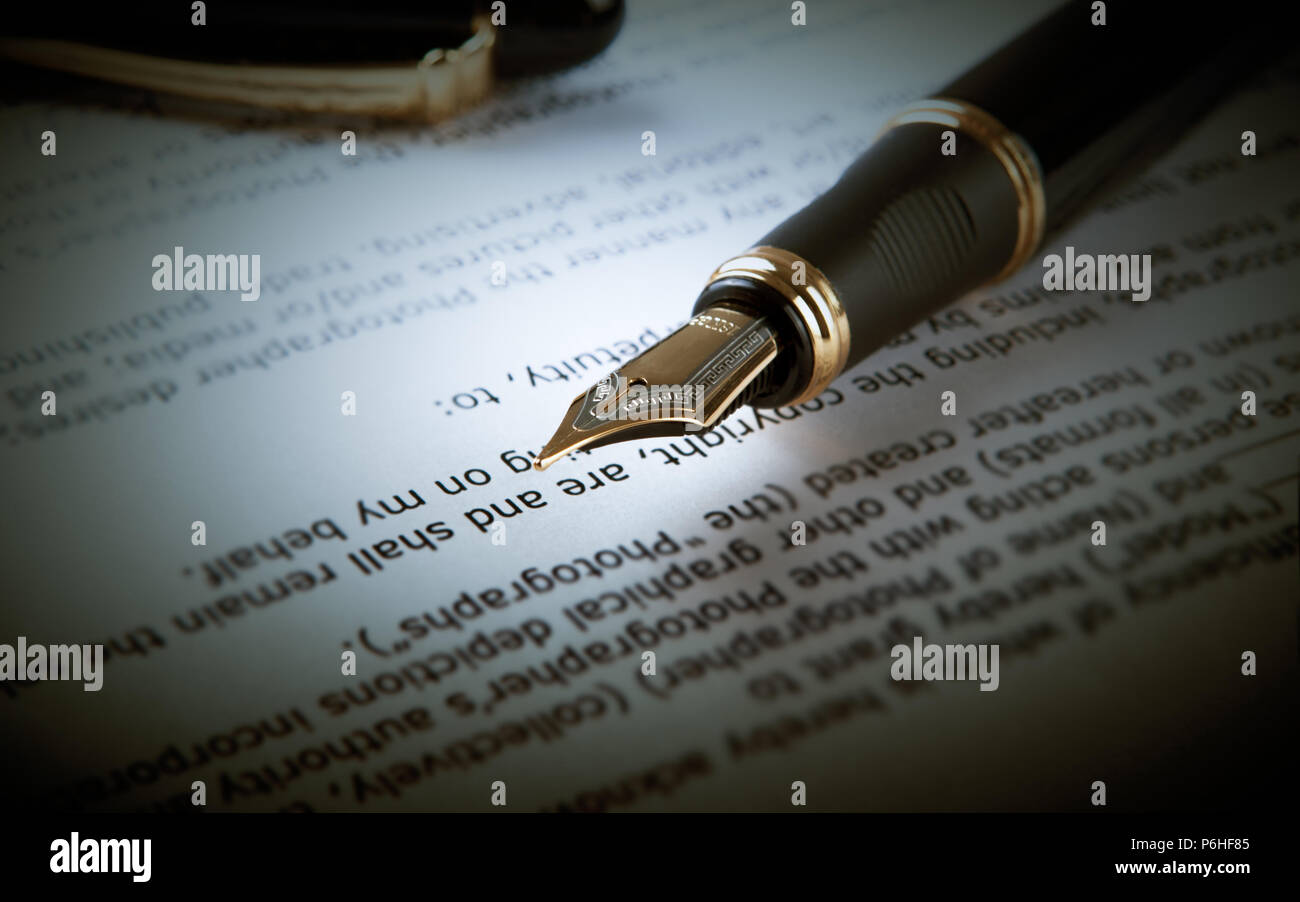 fountain pen on text sheet paper close-up Stock Photo - Alamy