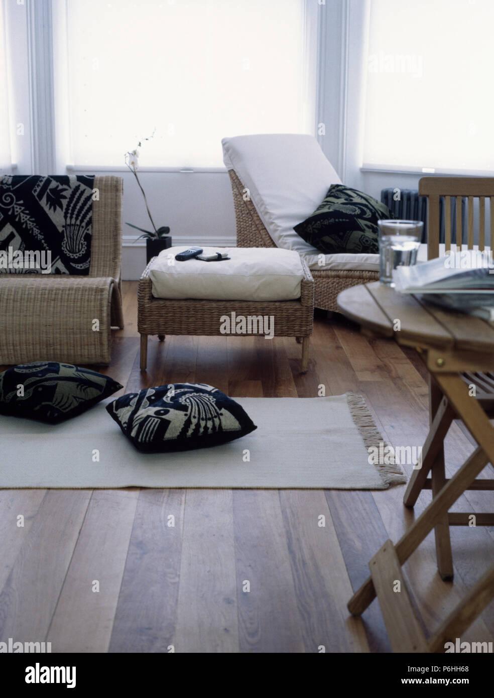 white wicker living room furniture on Black White Cushions And Wicker Furniture With White Cushions In Living Room With Cream Rug Stock Photo Alamy