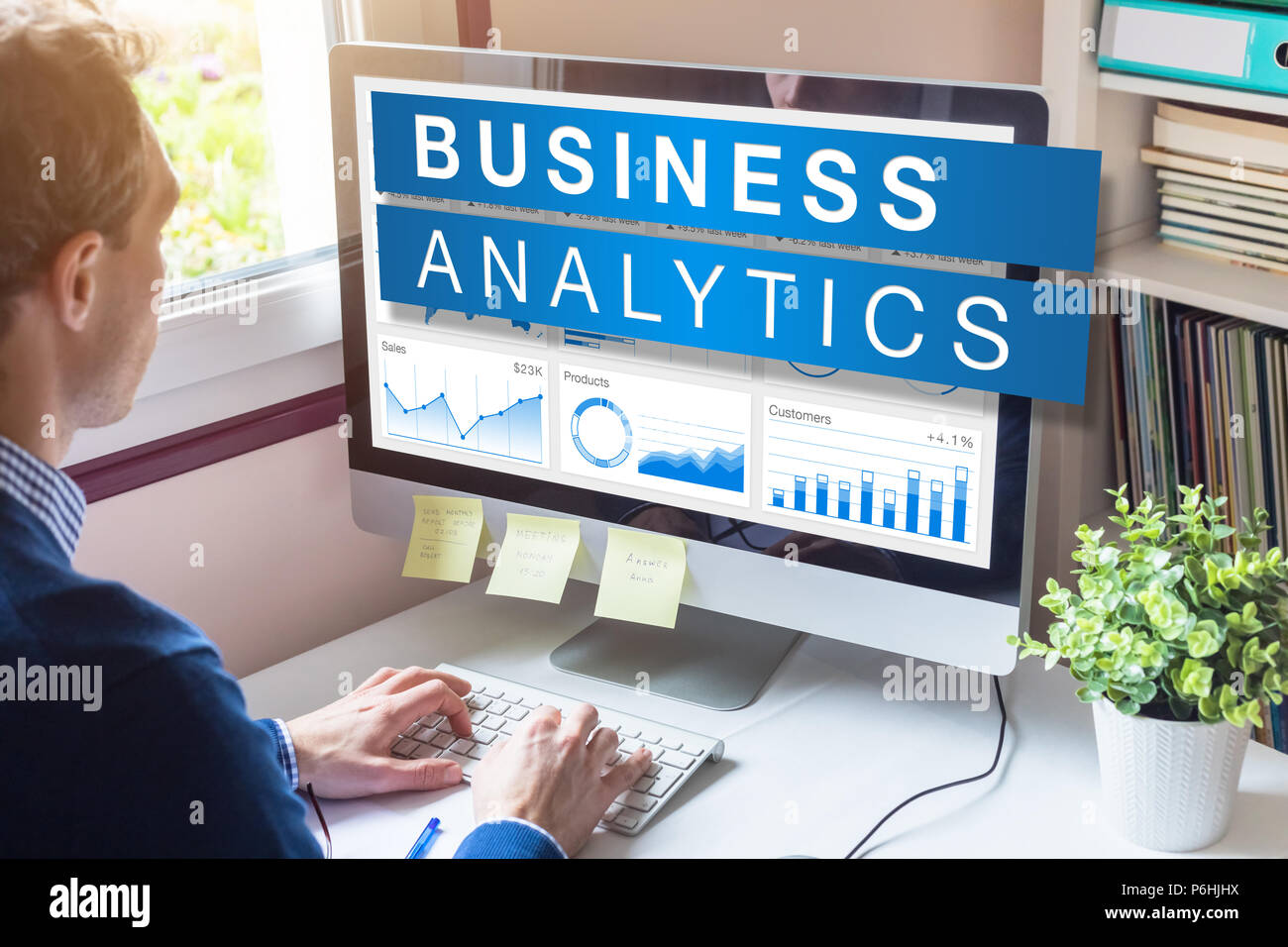 Business analytics and metrics for strategic decisions based on insights, data mining and modeling technology, analyst businessman working on computer Stock Photo