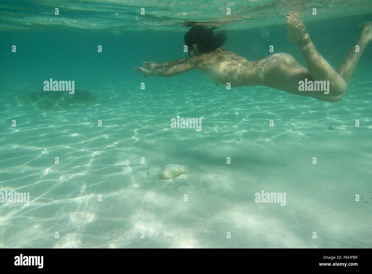 mujer desnuda buceando, Cala Marmols, Ses Salines,mallorca, islas baleares,  spain, europa Stock Photo - Alamy