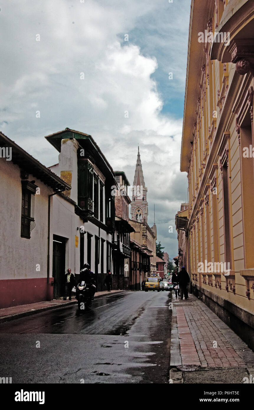Church spire over a street in Bogota, Colombia Stock Photo