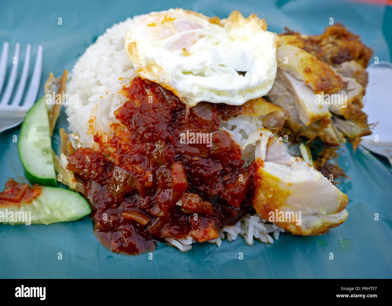 Nasi lemak or coconut milk rice, popular dish in Malaysia. Stock Photo
