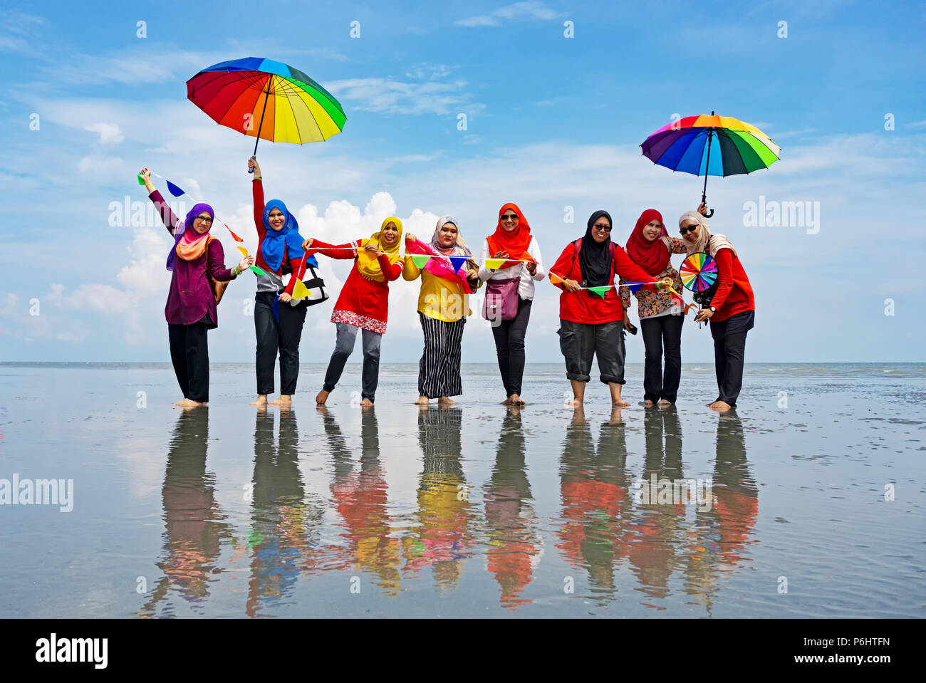 Kuala Selangor, Malaysia - September 9, 2017:  Group of unidentified people at Sasaran beach also known as Sky Mirror, popular local attraction in Sel Stock Photo