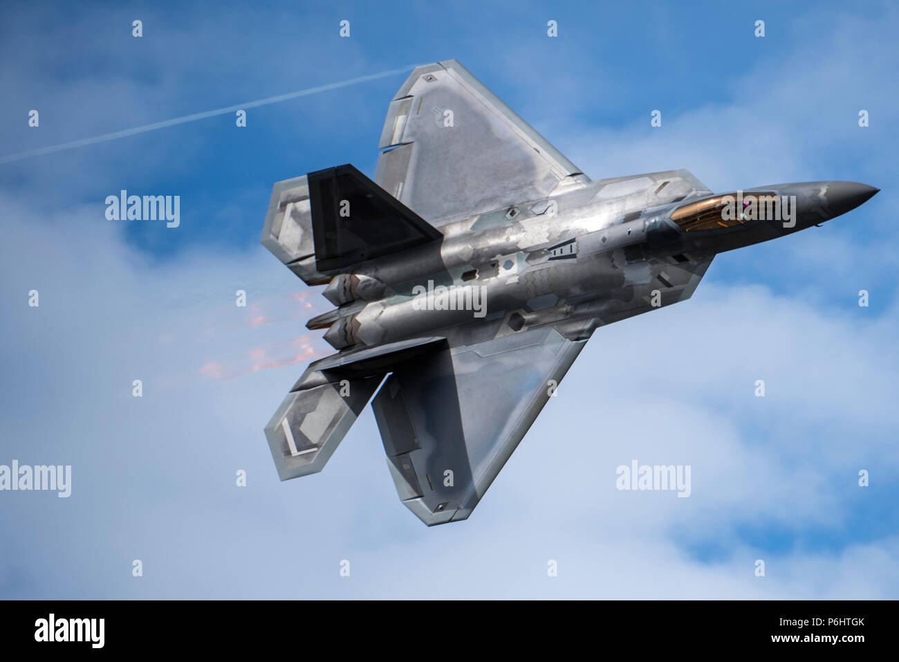 a-us-air-force-f-22-raptor-zooms-past-spectators-during-the-f-22-demonstration-at-the-arctic-thunder-open-house-special-needs-and-department-of-defense-family-day-at-joint-base-elmendorf-richardson-alaska-june-29-2018-during-the-biennial-open-house-jber-opens-its-gates-to-the-public-and-hosts-multiple-performers-including-the-us-air-force-thunderbirds-jber-joint-forces-demonstration-and-the-us-air-force-f-22-raptor-demonstration-team-us-air-force-photo-by-senior-airman-javier-alvarez-P6HTGK.jpg