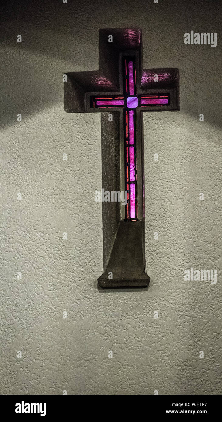Cross back lit by stained glass, Calvary United Methodist Church