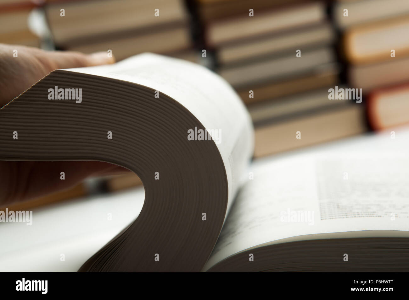 flipping book on with pile of books close up Stock Photo