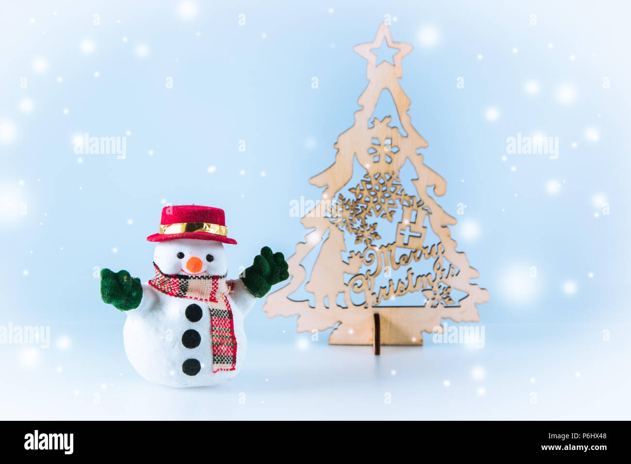 snowman near christmas tree on white background snow flake is falling down - White Christmas Tree Snowman snowman near christmas tree on white background snow flake is falling down - White Christmas Tree Snowman